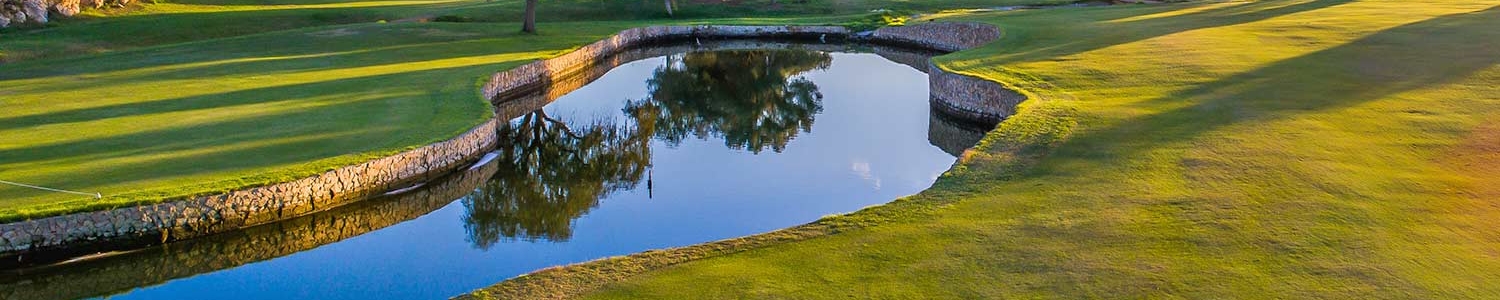 Mallorca golf course with stream running through the course at sunset
