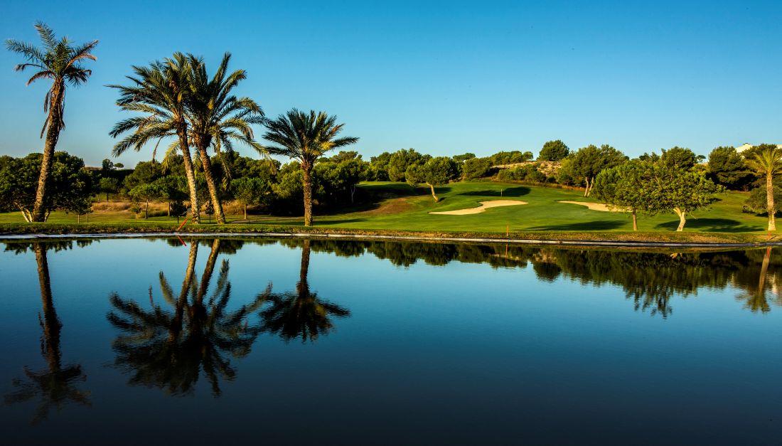 Large blue lake protecting the green at Alenda Golf