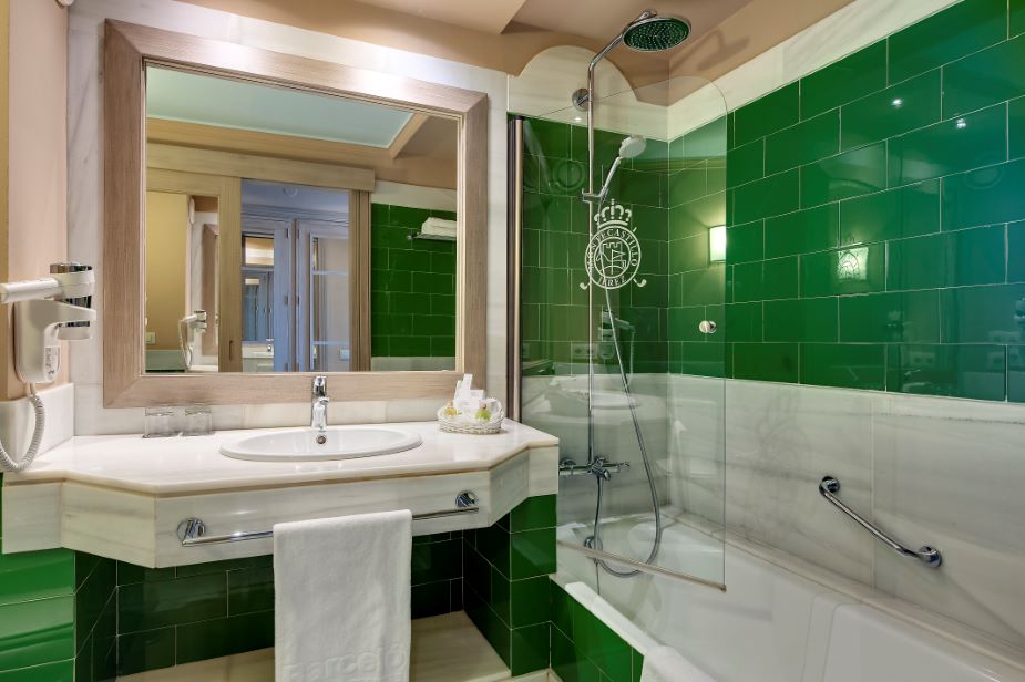 Bathroom with green tiles at Barcelo Montecastillo Golf Resort