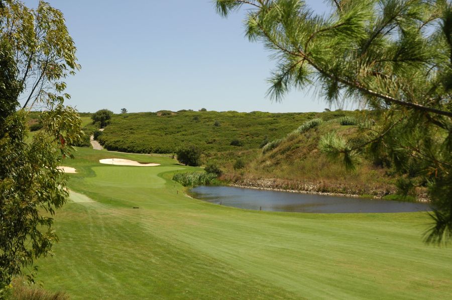 Lake to the right of the fairway as it looks towards the green at Belas Golf Club