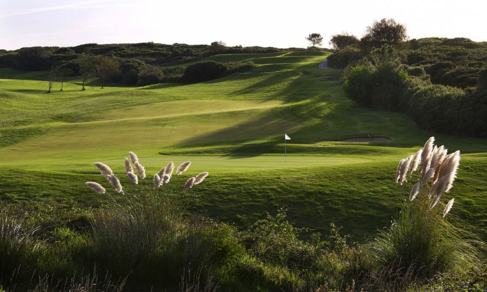 Putting green with flag at Belas Golf Course near Lisbon