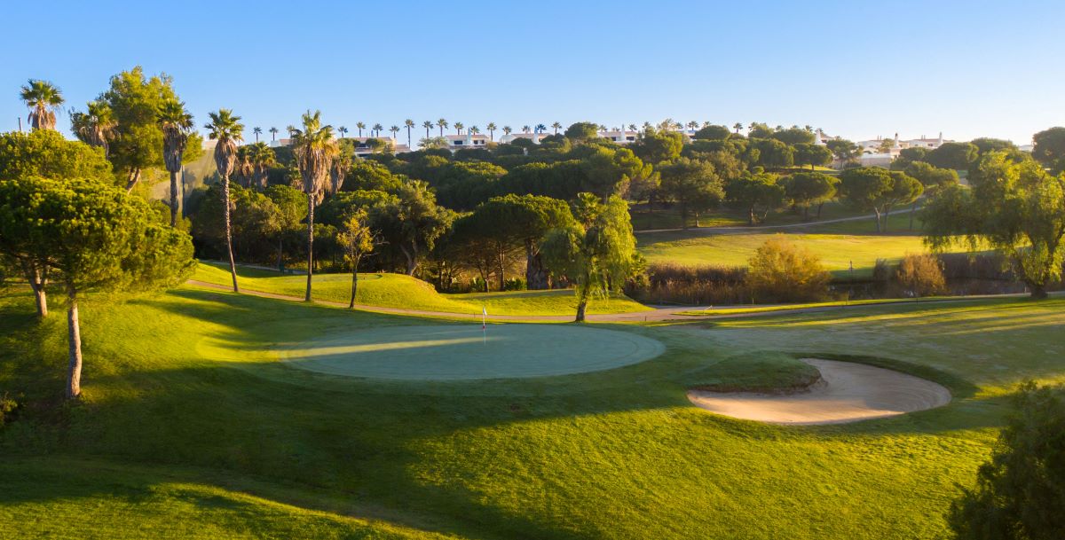 Putting green with trees in the distance at Castro Marim Golf in Eastern Algarve
