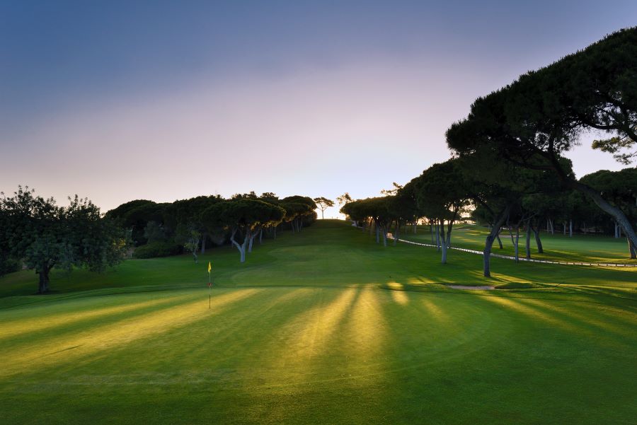 Sunset with purple sky and light across the golf course at Dom Pedro Golf Old Course in Vilamoura