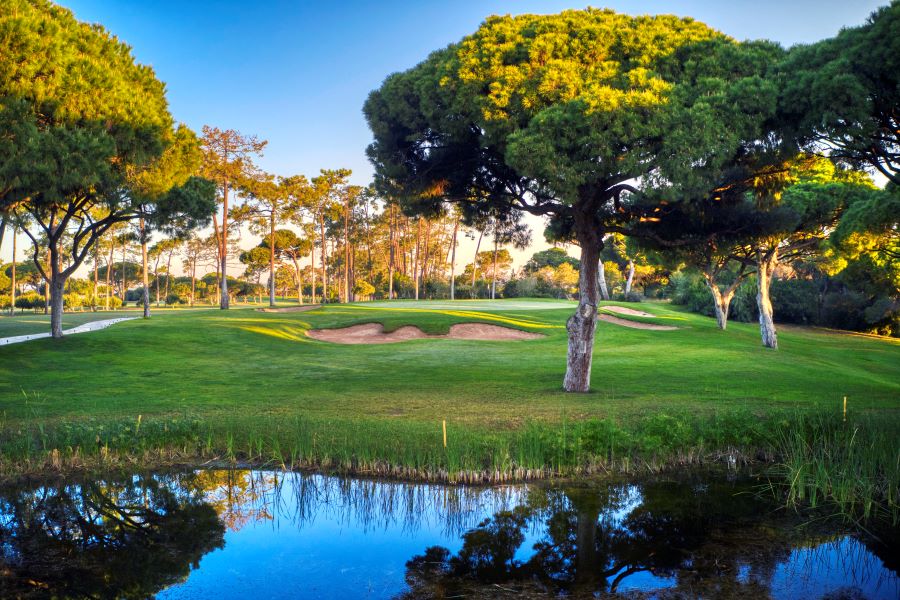 Lake in front of the fairway and green at Dom Pedro Golf Old Course in Vilamoura