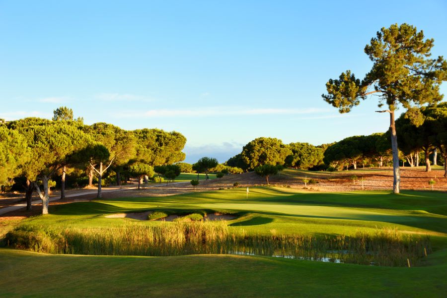 Dom Pedro Golf Pinhal Course with water splitting the fairway