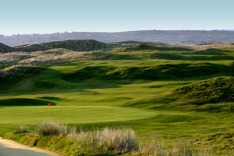 Lush green putting area on a hole at Donegal Golf Club