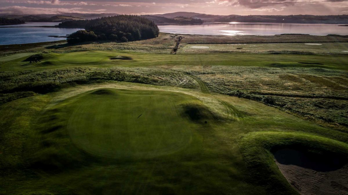 Tee box at Donegal Golf Club in Ireland with the coast in the distance