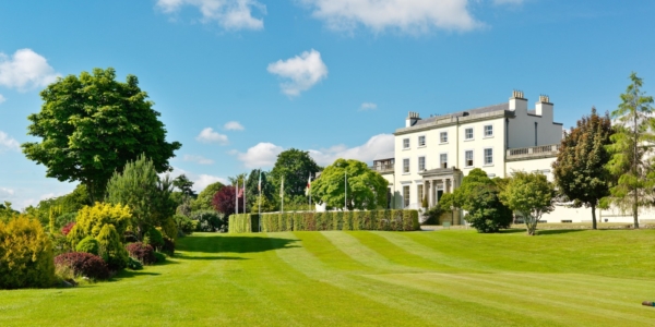 Exterior of Druids Glen Resort with golf course in the foreground