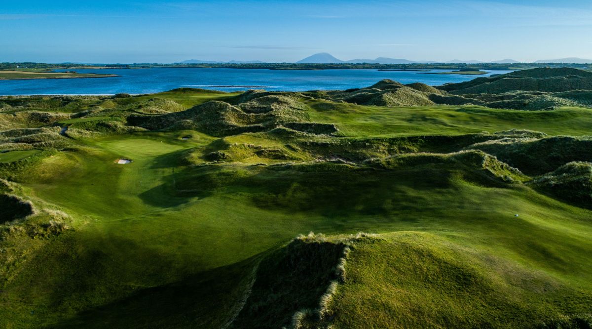Blue sea in the distance with blue sky overhead at Enniscrone Golf Club