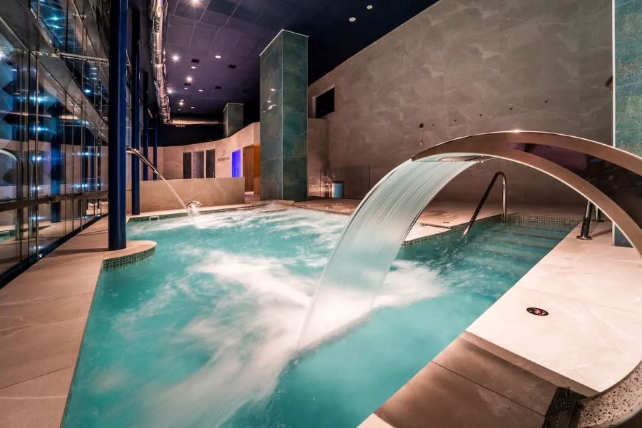 Indoor pool with water fountain at Gran Hotel Bali