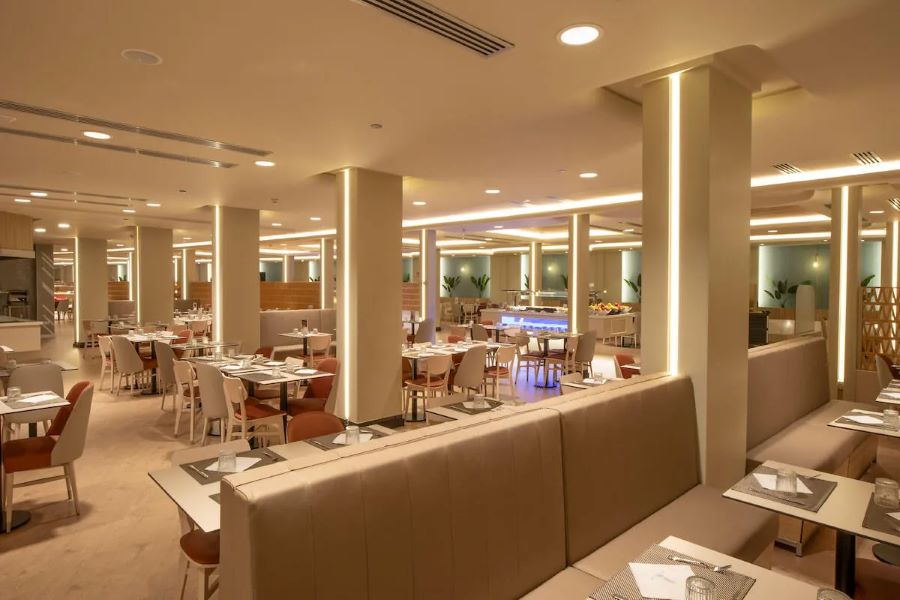 Booths, tables and chairs in large restaurant at Gran Hotel Bali