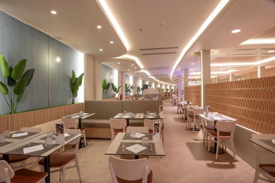 Tables and chairs at Gran Hotel Bali in the restaurant ready for service
