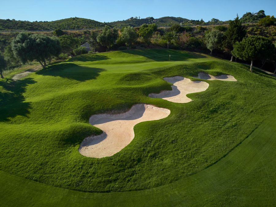 Large sand bunkers protecting the green at Higuerón Marbella Golf Resort in the Costa Del Sol