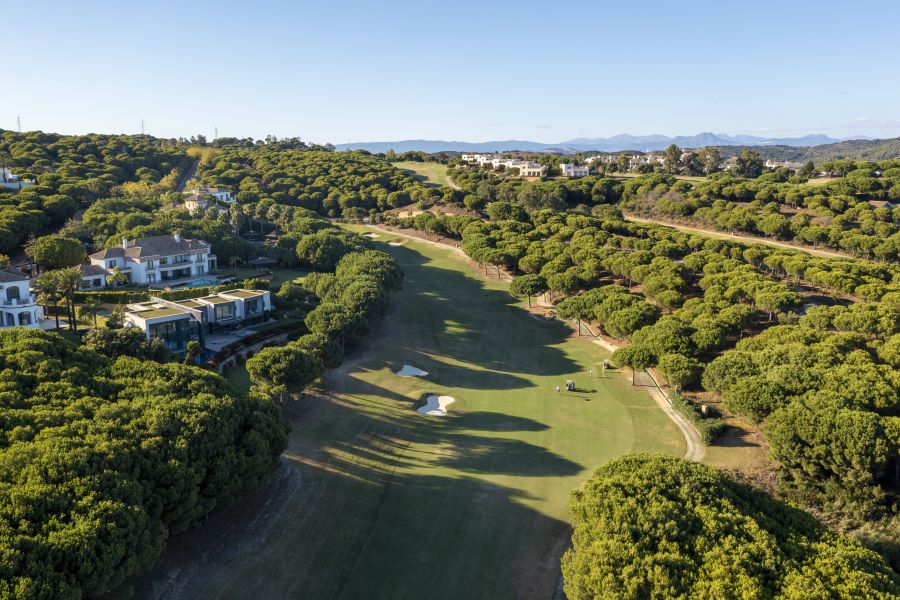 Fairway of La Reserva Golf Course with villas down left side