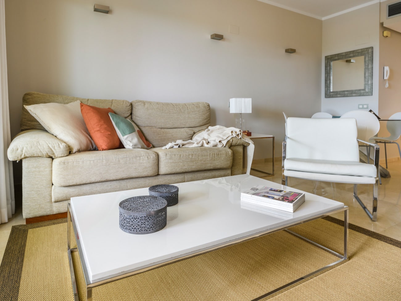 A beige couch and chair in a Las Colinas Golf And Country Club room