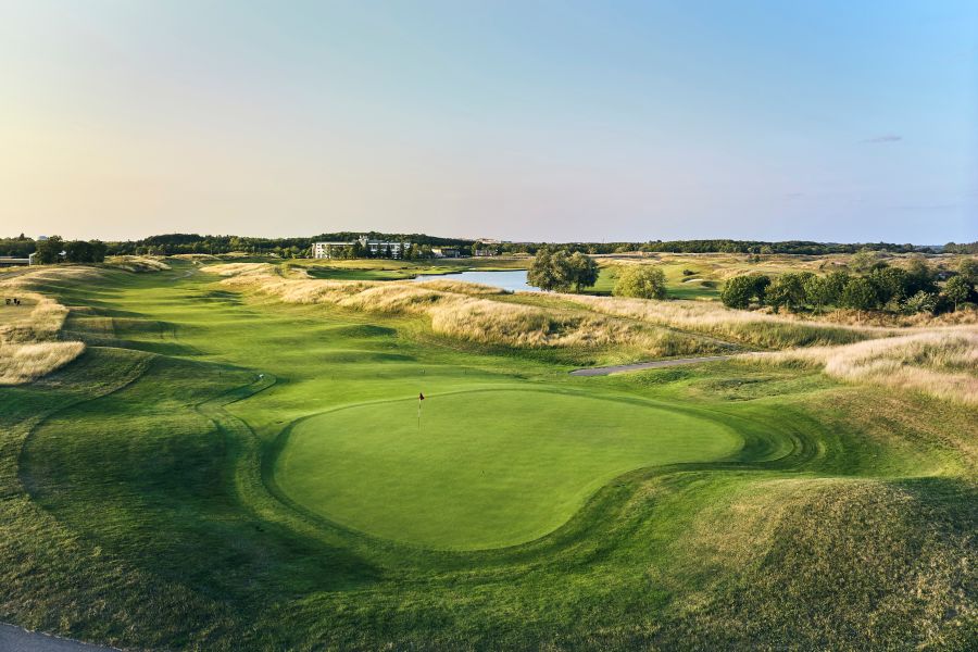 Large putting green with long grass surrounding the fairway at Le Golf National near Paris, France