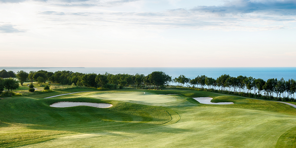 Blue sky over the fairways with the Black Sea in the distance at Lighthouse golf course