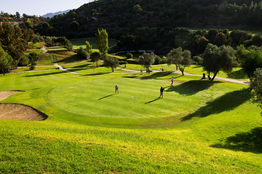 Lush green fairways looking down to putting green at Los Arqueros Golf & Country Club