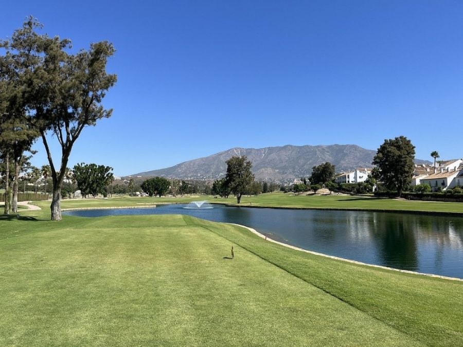 View from tee box with blue sky over the mountain at Mijas Golf Club in the Costa Del Sol