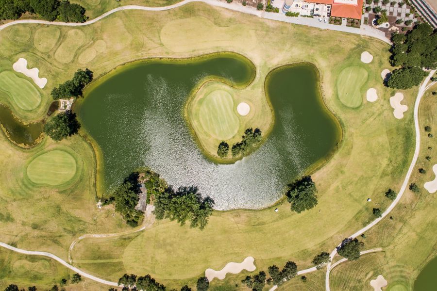 Lake with island green at Montado Golf Course near Lisbon, Portugal