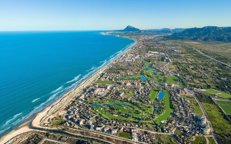 Drone shot of Oliva Nova resort including golf course with the beach and sea next to it