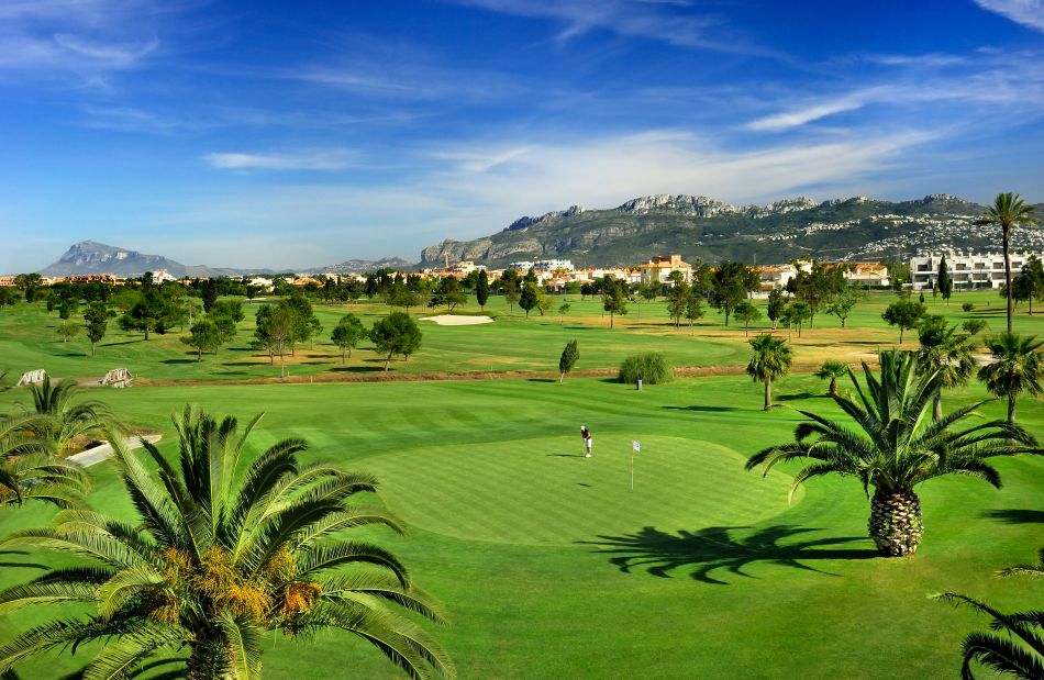Two golfers on the green at Oliva Nova Golf Course in Spain