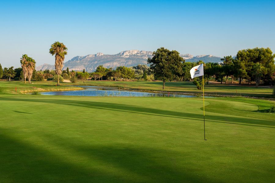 Flag on the green at Oliva Nova golf course in Denia, Spain