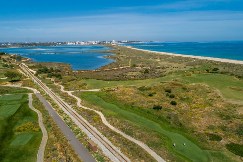 Clear blue sky over the sea and golf course at Palmares Ocean and Living Golf Club