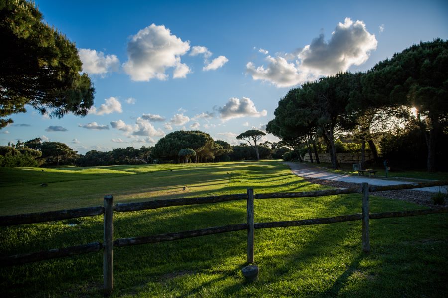 Fence with white clouds and blue sky at Quinta Da Marina golf course in Cascais, Lisbon