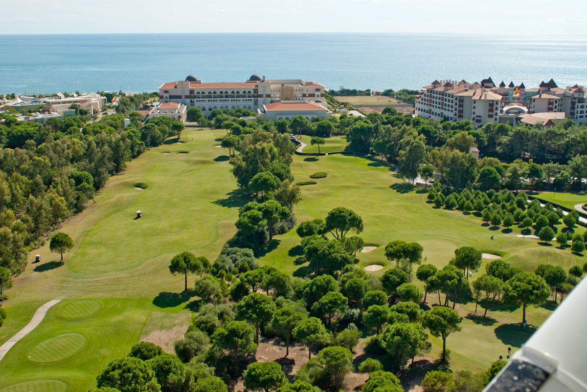 Ariel view of the golf courses with trees lining the fairway at Sirene Golf Resort