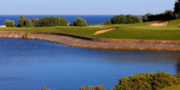 Water protecting the green the green with bunker on the bank