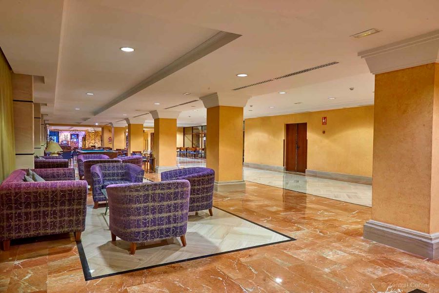 Purple seats in lounge area of bar at Zentral Center