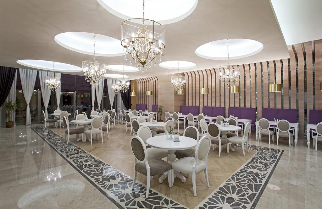Dining area with chandeliers at Sirene Hotel