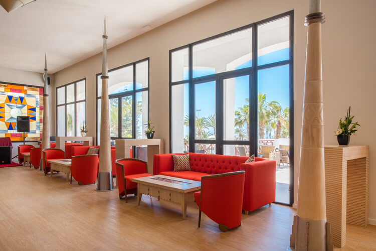 Lobby area with red chairs at Iberostar Founty Beach Hotel Agadir