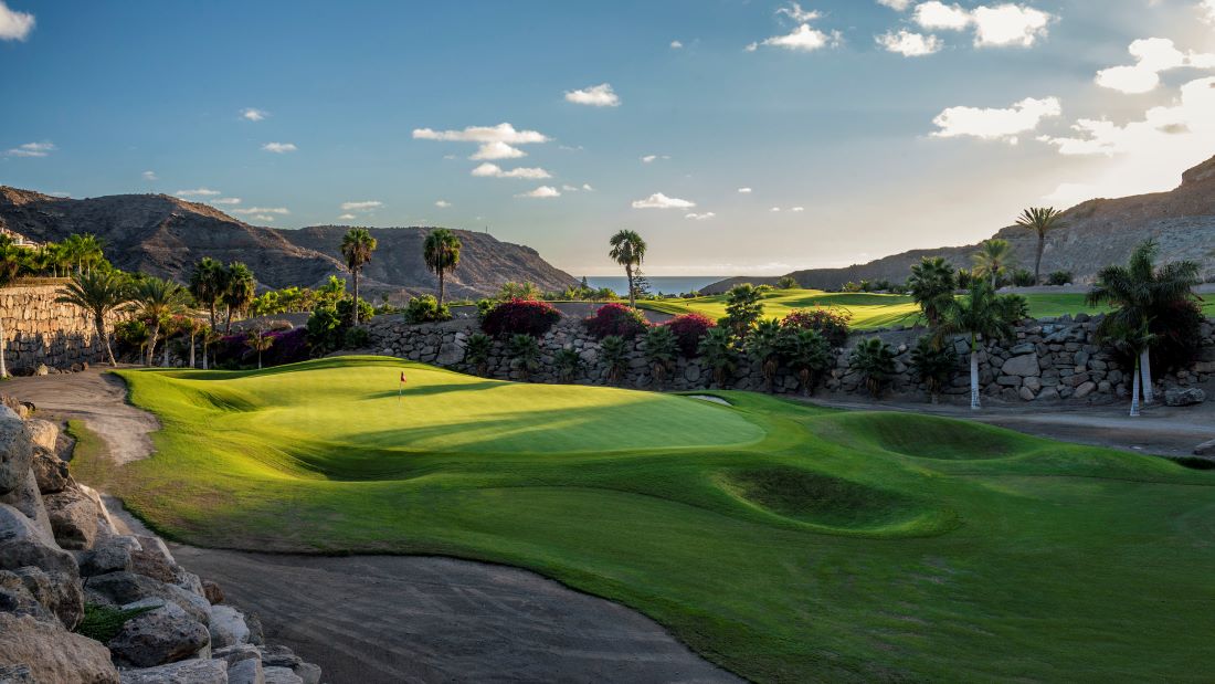 Green surrounded by rocks and plants at Anfi Tauro Golf Course in Gran Canaria, Spain