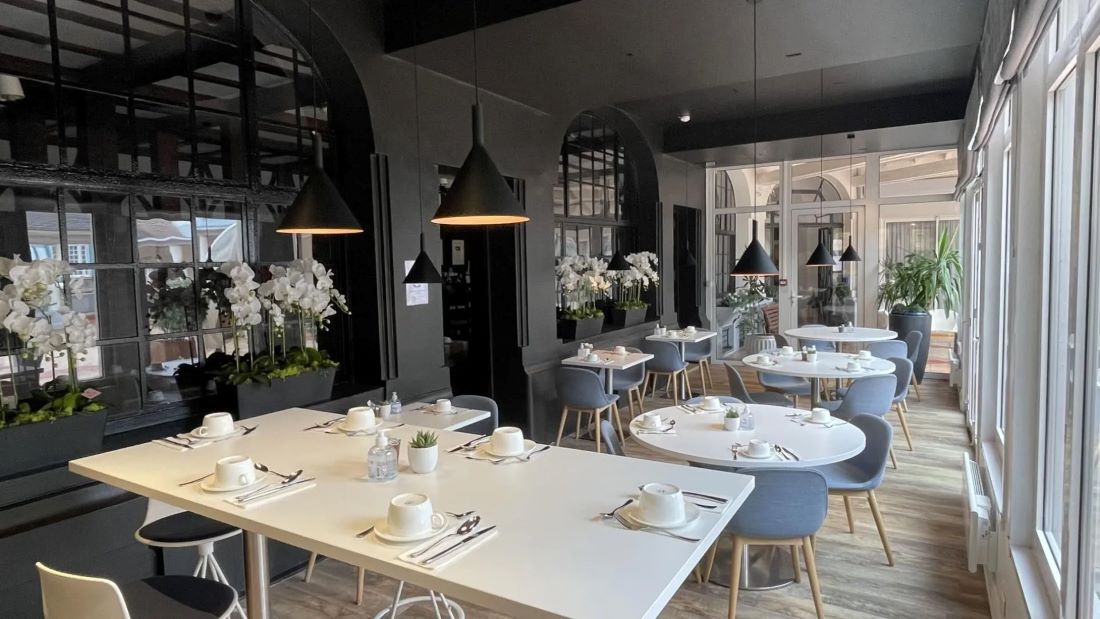 Restaurant with tables set ready for service at Hotel Bristol Le Touquet