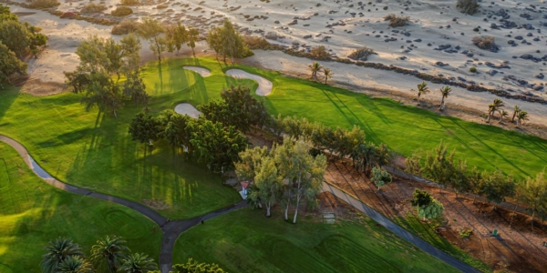 Maspalomas Golf course in Gran Canaria from the air, showing fairway and sand to the side of it
