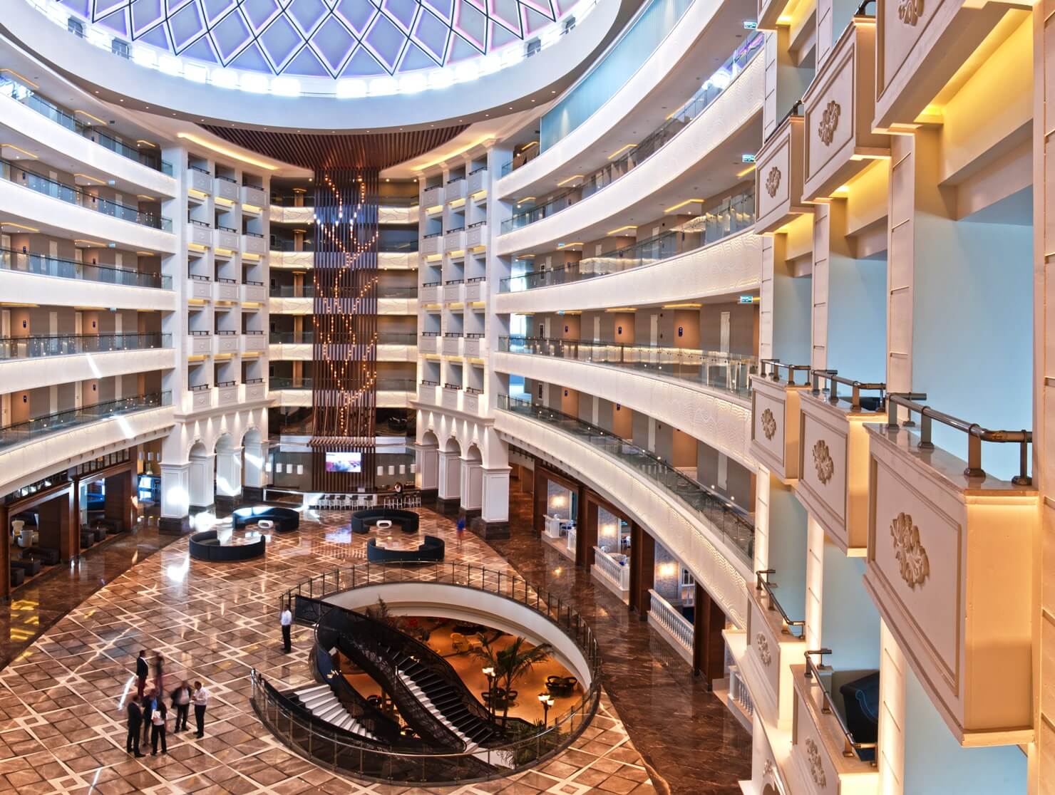 Ariel view of the lobby area overlooking guests from the balcony at Sueno Deluxe in Belek
