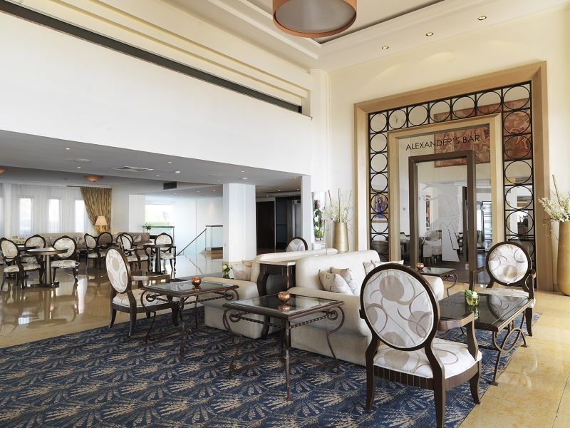 Lobby area with seats at Alexander The Great Beach Hotel