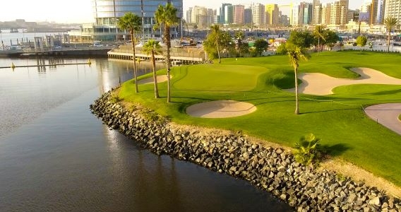 Dubai Creek Golf Club with water to the left