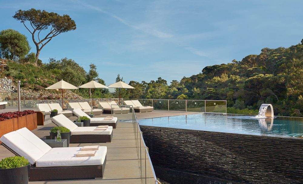 Swimming pool with sun loungers at Penha Longa Resort in Lisbon