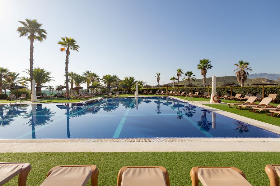 Sun loungers by the pool at Valle Del Este Golf Resort in Almeria