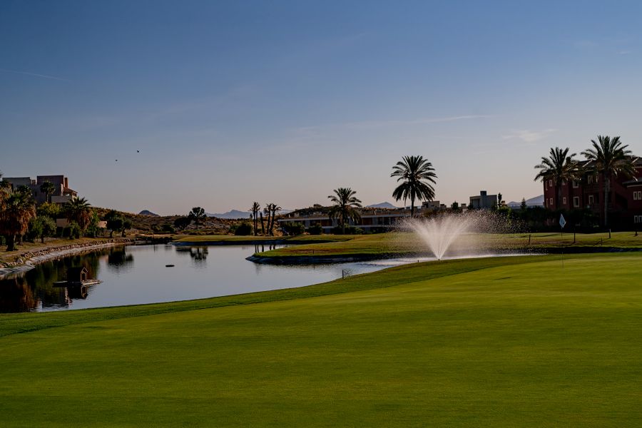 Water fountain on the lake at Valle Del Este Golf Resort's golf course