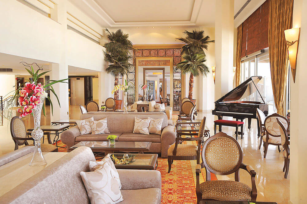 Black piano at Alexander The Great Beach Hotel with sofas and chairs