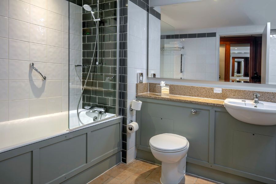 Bathroom at Belton Woods Hotel, Spa And Golf Resort with bath tub and toilet