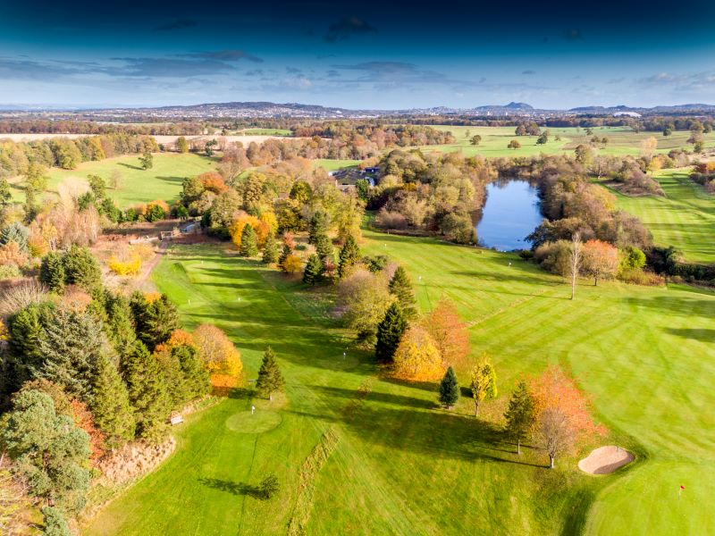 Trees lining fairway at Dalmahoy Hotel And Country Club