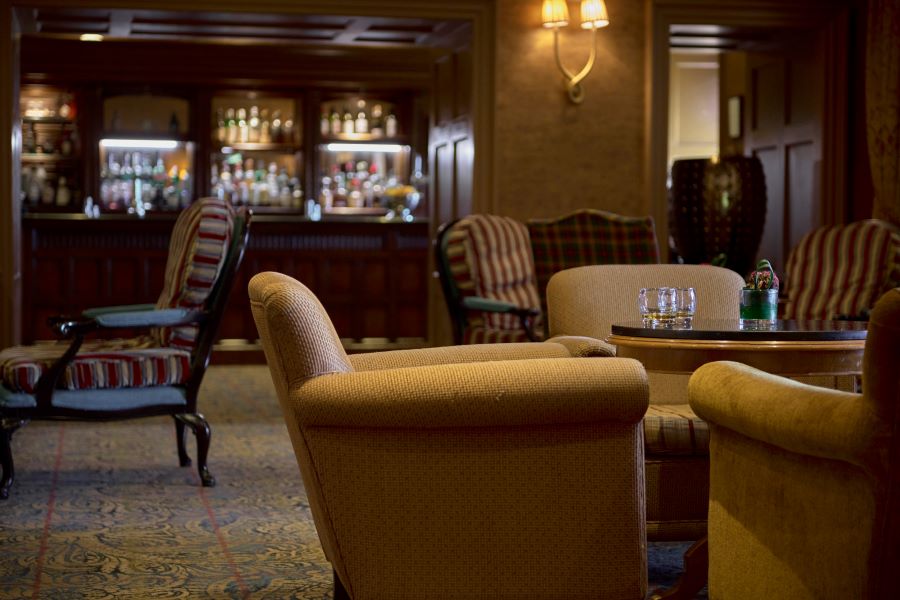 Leather chairs in bar at Dalmahoy Hotel And Country Club