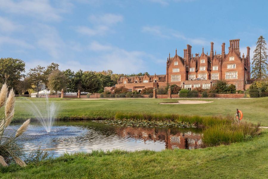 Exterior of Dunston Hall Golf And Spa Hotel near Norwich with lake in foreground
