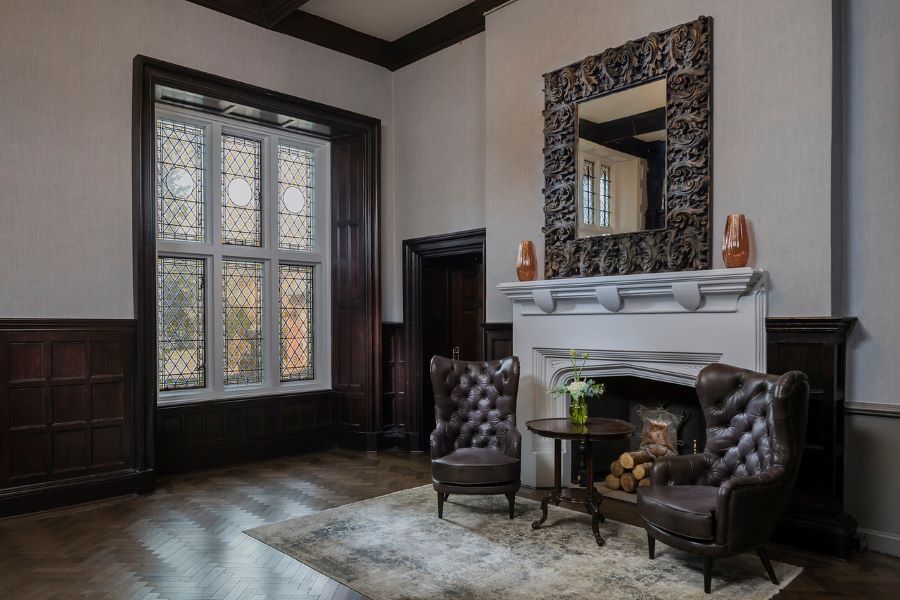 Chairs by fireplace at Dunston Hall Golf And Spa