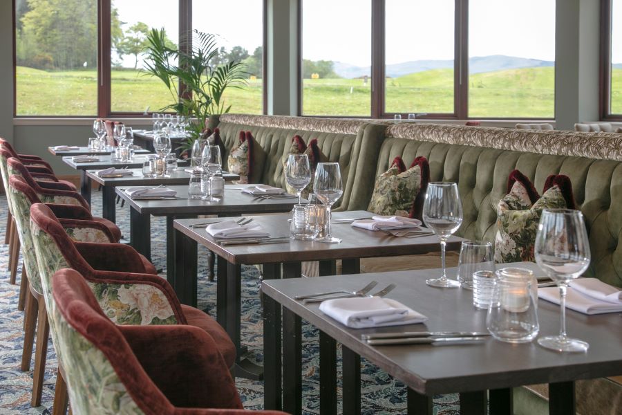 Wine glasses on the table along with cutlery at Glasgow Westerwood Hotel, Spa & Golf Resort